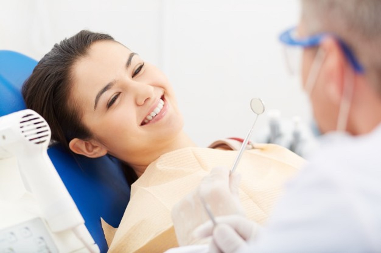 young woman receiving dental check up